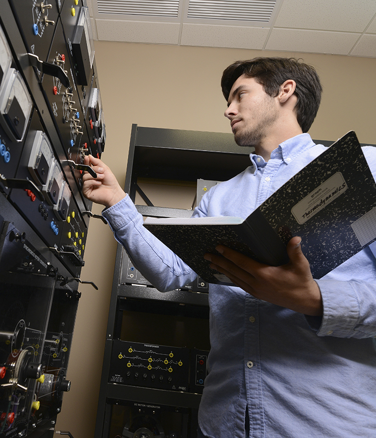 Electrical Engineering student works with circuits