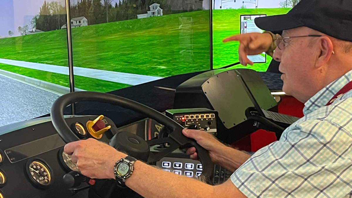 Member testing the fire truck driving simulator at Tyndall Air Force Base