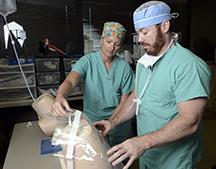 Two nurse anesthesia students with model